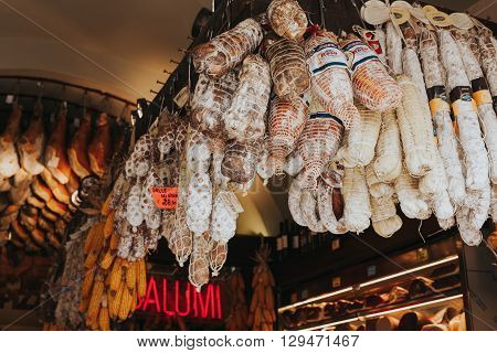 ROME, ITALY - APRIL 22 2016: Arrangement of salamis on a typical roman shop on April 22, 2016 in Rome, Italy.