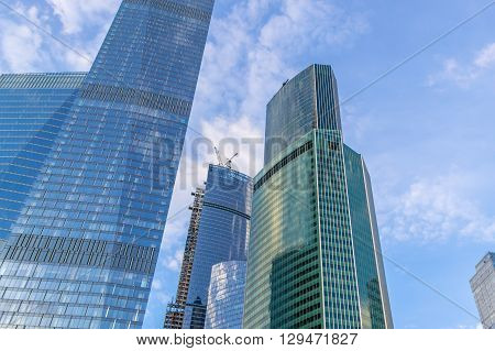 Veritical photo with buildings of Moscow City under blue sky with clouds. Moscow Russia. May 02 2016.