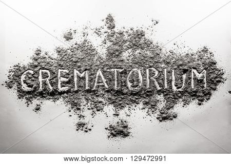 Crematorium crematory word written in grey ash dust cloud