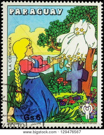 MOSCOW RUSSIA - MAY 11 2016: A stamp printed in Paraguay shows Cinderella with new dress scene from fairy tale series 