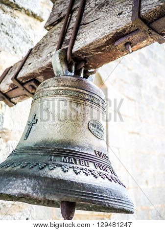 Figueres Spain - September 20 2014: A beautiful bell seen on the Mare de Deu del Mont sanctuary (Understandable Text: Manuel Roses foundry Valencia)