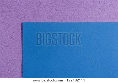 Eva foam ethylene vinyl acetate smooth blue surface on light purple sponge plush background
