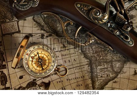 Ancient Map And Antique Handgun And Brass Compass