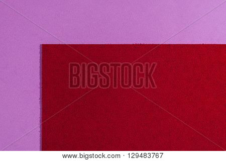 Eva foam ethylene vinyl acetate sponge plush red surface on light purple smooth background