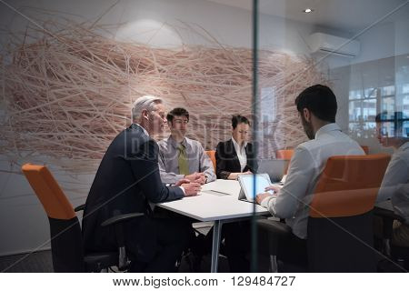 business people group brainstorming on meeting and businessman presenting ideas and projects oon laptop and tablet computer