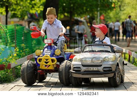 Orel Russia - May 9 2016: Celebration of 71th anniversary of the Victory Day (WWII). Children racing small cars closeup