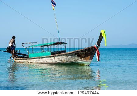 CRABI PROVINCE THAILAND - FEBRUARY 04 2015: Traditional thai long tail boat waiting for tourists to travel to beautiful islands in Thailand