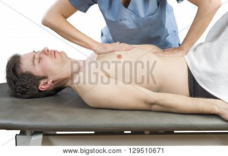 Physiotherapist Is Doing An Activation Of The Diaphragm. Massage To A Man Patient..