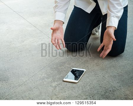 Felling Sad Person Droped Smartphone on Floor with Copy Space