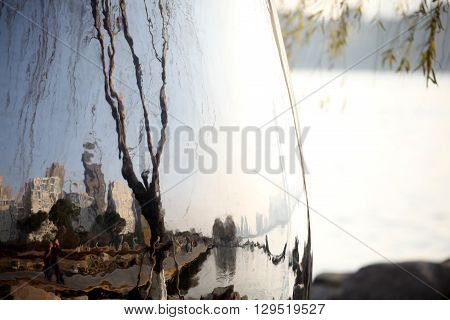 City scenic view is seen on a building with reflective surface material on Xihu Lake, Hangzhou.