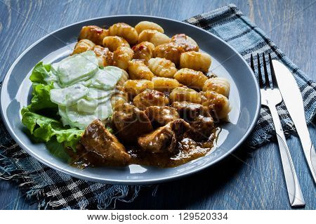 Italian Potato Dumplings With Stew And Cucumber Salad