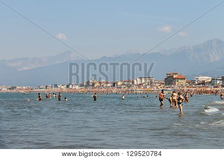Viareggio Italy - June 28 2015: People resting on the beach. Viareggio is the famous resort on the coast of the Ligurian Sea