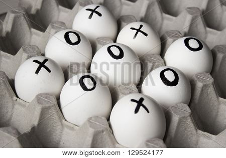 WIN. Drawing white on eggs - tic-tac-toe game