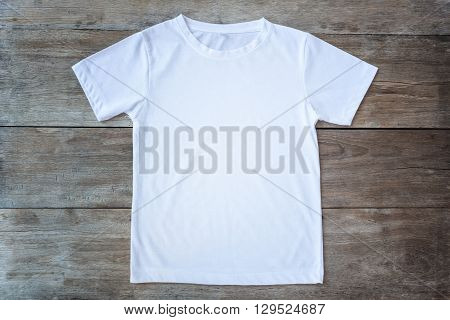Top View Of Color T-shirt On Grey Wood Plank