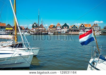 Volendam Holland - July 24 2014: Waterland district boats in the harbour in front of the town center