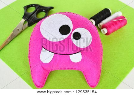 Pink felt monster. Fun baby soft toy