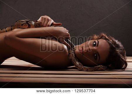 Sexy Brunette Girl With Orange Python Around Her Neck