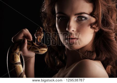 Sexy Brunette Girl With Orange Python Around Her Neck