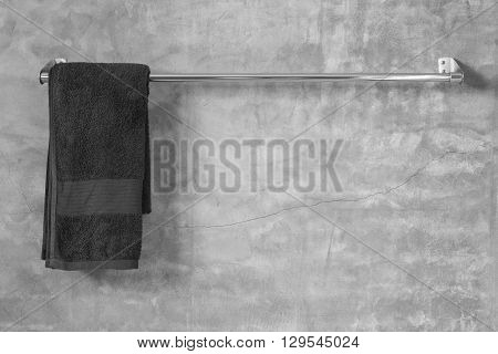 Stainless Steel Towel On Grey Cement Wall With Towel In Bathroom