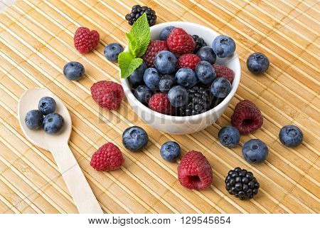 Fresh colorful berries in a bowl - healthy breakfast