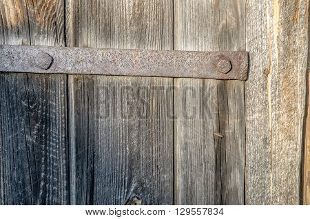 forged parts on an old wooden door