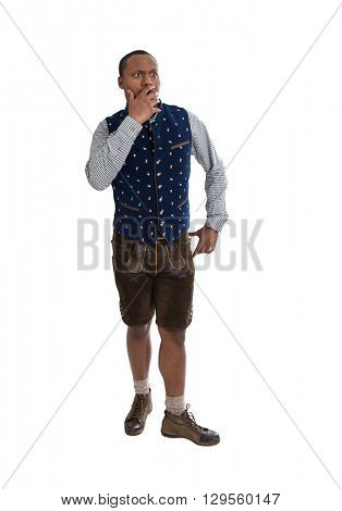 Shocked and wondering isolated colored man wearing traditional bavarian clothes.