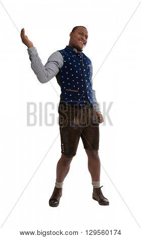 Isolated dark skinned man wearing typical bavarian clothes making promotion for the bavarian beer festival in Munich called Oktoberfest.