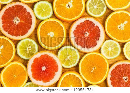 Citrus Fruit Background With Sliced F Oranges Lemons Lime Tangerines And Grapefruit