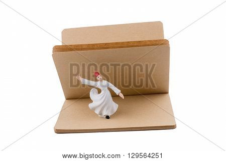 Sufi Dervish on a notebook on white background