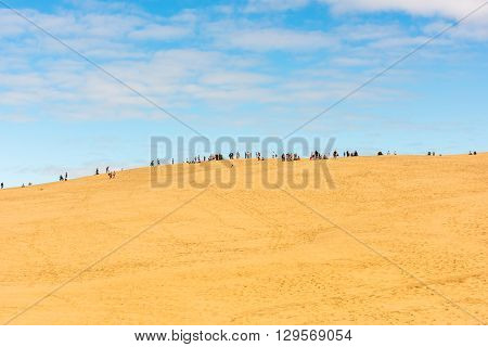People Visiting The Highest Sand Dune Of Pyla In Europe