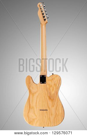 Wooden telecaster form six string guitar on neutral background