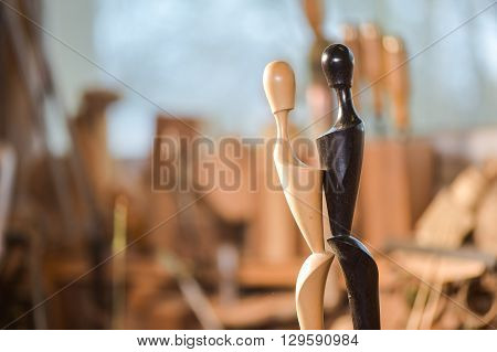 Woodturners Using A Rotating Clamp To Turn The Wood.