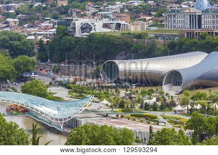 TBILISI GEORGIA - MAY 07 2016: Theater of Music and Drama Exhibition Hall and Presidential Palace are the Modern Tbilisi located in Rike Park Georgia