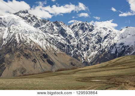 Mountain Landscape In Georgia Kaukaz With Beautiful Sky