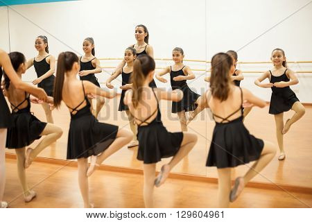 Little Dancers In Front Of A Mirror