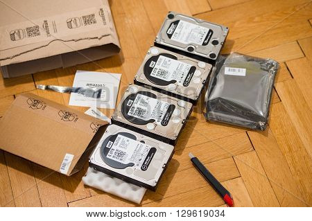 PARIS FRANCE - MAR 18 2016: Four Western Digital Hard disk drive with diverse capacity ranging from 1 tb to 6 tb arranged on floor after Amazon.com product e-commerce unboxing