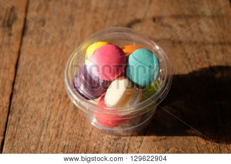 many color macaroons on the wood floor