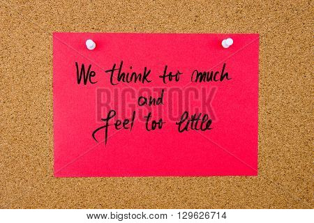 Red Paper Note With Handwritten Text On Cork Board