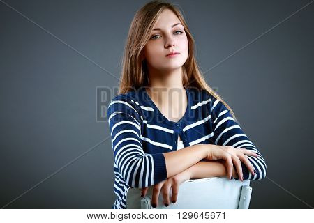 Beautiful woman in studio looking at camera