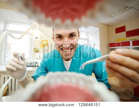 view from a dentist mouth. student dentist takes practice