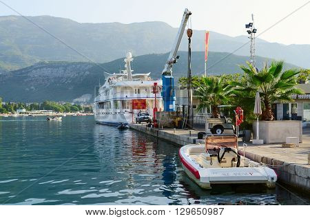 BUDVA MONTENEGRO - SEPTEMBER 17 2015: Pleasure yacht at the pier Dukley Marina on the waterfront of the popular resort of Budva Montenegro