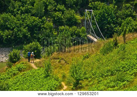 Landscape with pedestrian bridge at river Uvac gorge, southwest Serbia
