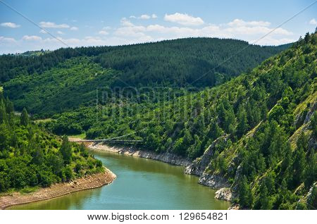 Landscape with pedestrian bridge at river Uvac gorge, southwest Serbia