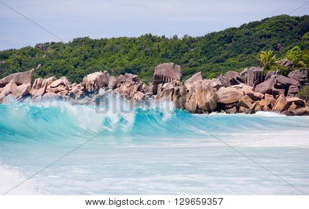 Seychelles, LaDigue Island beach, wild granite rocks and wavy sea