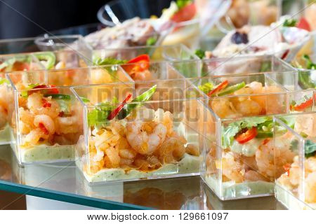 Buffet Table Detail Of Prawn Canapes In Plastic Dishes.