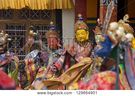 LAMAYURU INDIA - JUNE 13 2015: An unidentified buddhist lamas dressed in mystical mask dancing Tsam mystery dance in time of Yuru Kabgyat Buddhist festival at Lamayuru Gompa Ladakh North India
