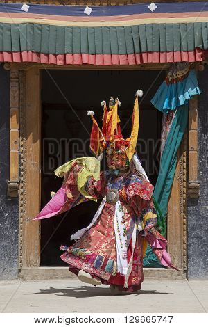 LAMAYURU INDIA - JUNE 13 2015: An unidentified buddhist lamas dressed in mystical mask dancing Tsam mystery dance in time of Yuru Kabgyat Buddhist festival at Lamayuru Gompa Ladakh North India