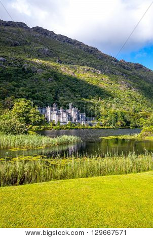 Calway Ireland - August 4 2013: Connemara area the Kylemore abbey on the Pollacappul lake