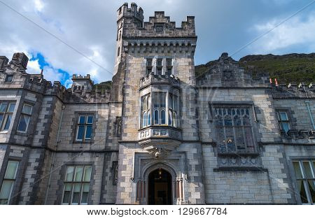 Calway Ireland - August 4 2013: Connemara area upward view of the Kylemore abbey on the Pollacappul lake