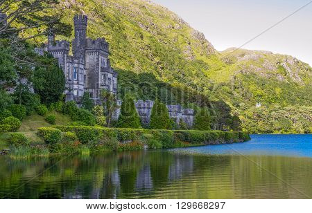 Calway Ireland - August 4 2013: Connemara area the Kylemore abbey on the Pollacappul lake